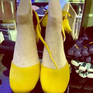 Mustard satin YSL heels.